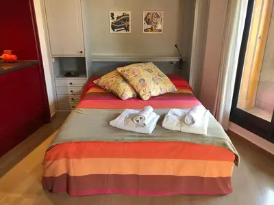 Cama o camas de una habitación en Loft acogedor con terraza y parking en el centro