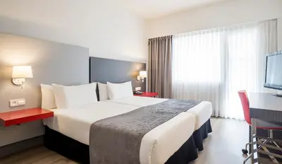Cama o camas de una habitación en Ilunion Romareda