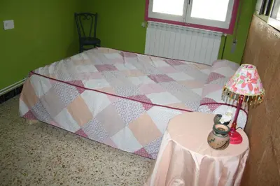Cama o camas de una habitación en Apartamento Benabarre Huesca