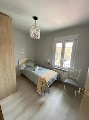Cama o camas de una habitación en Apartamento turístico La Torre