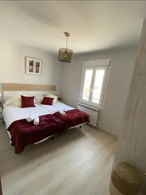 Cama o camas de una habitación en Apartamento turístico La Torre