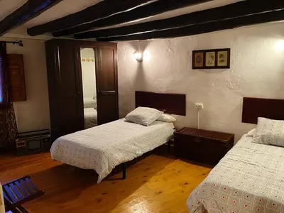 Cama o camas de una habitación en El balcón de Reznos, Soria