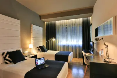 Cama o camas de una habitación en Habitus Hotel Leyre