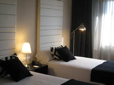 Cama o camas de una habitación en Habitus Hotel Leyre