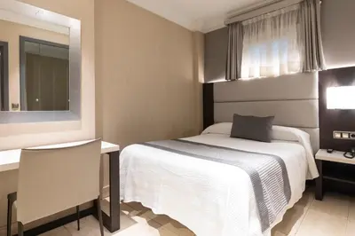 Cama o camas de una habitación en Habitus Hotel Europa