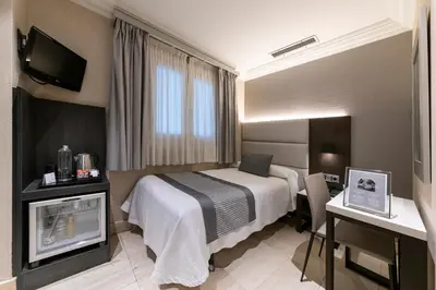 Cama o camas de una habitación en Habitus Hotel Europa