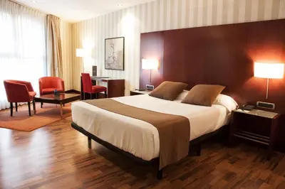 Cama o camas de una habitación en Zenit Lleida
