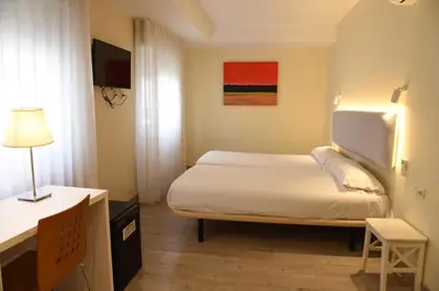 Cama o camas de una habitación en Hotel Delta