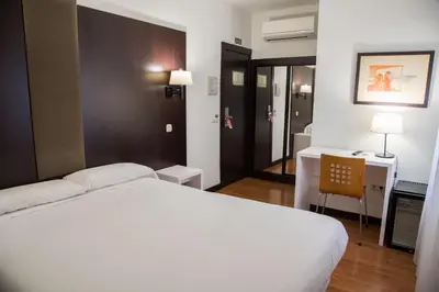 Cama o camas de una habitación en Hotel Delta