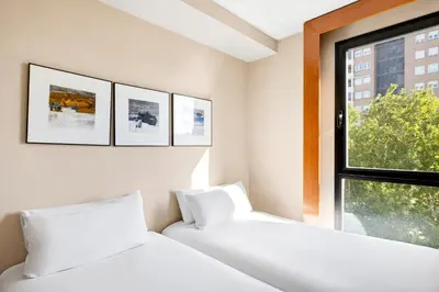 Cama o camas de una habitación en B&B HOTEL Zaragoza Los Enlaces Estación