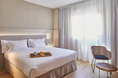 Cama o camas de una habitación en Silken Reino de Aragón