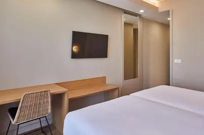 Cama o camas de una habitación en Silken Reino de Aragón
