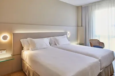 Cama o camas de una habitación en Silken Reino de Aragón