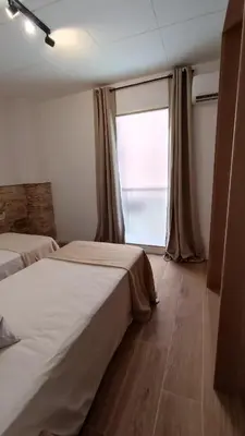 Cama o camas de una habitación en BOUTIQUE Apartment AVE Centro Lleida