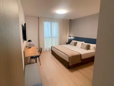 Cama o camas de una habitación en Hotel Real