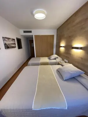 Cama o camas de una habitación en Hotel Nadal