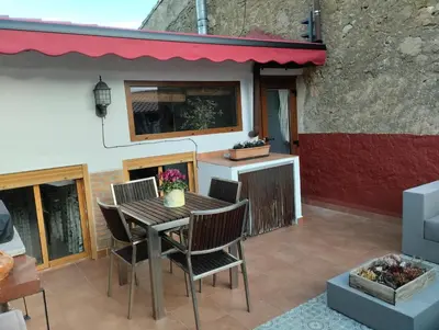 Un balcón o terraza de LES LLÚDRIGUES Casa Loft con aire ac y terraza