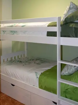 Cama o camas de una habitación en Casa acogedora con barbacoa
