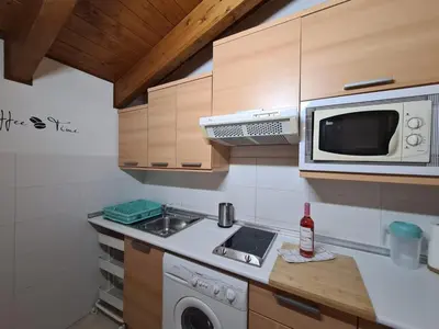 Una cocina o zona de cocina en Dos Torres Númenor Ático Abuhardillado