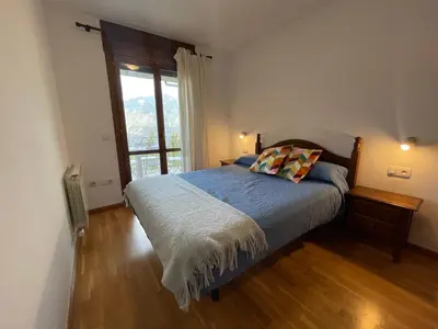 Cama o camas de una habitación en C18 - Alojamiento Mirador de Cerler - Villmor