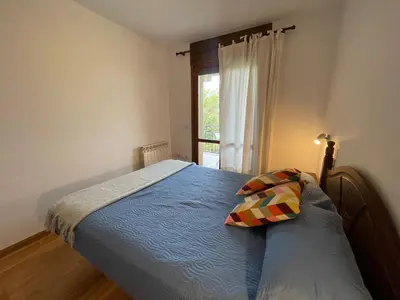 Cama o camas de una habitación en C18 - Alojamiento Mirador de Cerler - Villmor
