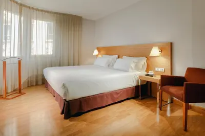 Cama o camas de una habitación en Hesperia Zaragoza Centro