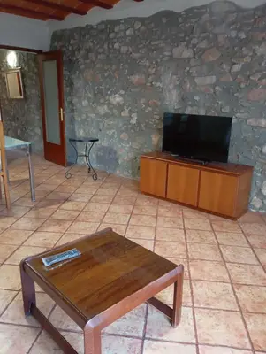 Una televisión o centro de entretenimiento en Ca L'Aida Rural 2
