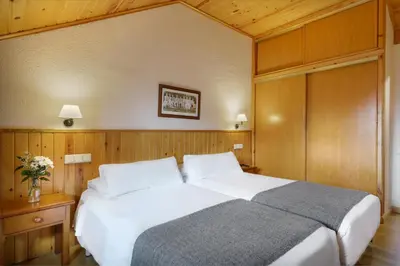 Cama o camas de una habitación en Hotel Nievesol