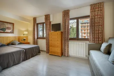 Cama o camas de una habitación en Hotel Nievesol