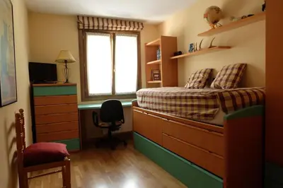 Cama o camas de una habitación en Casa rústica familiar en los Pirineos