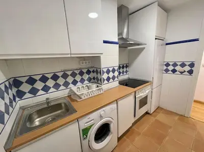 Una cocina o zona de cocina en Acogedor apartamento en Zaragoza