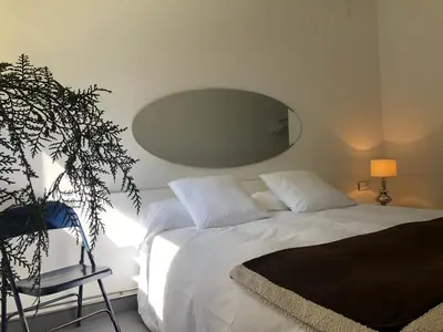 Cama o camas de una habitación en Acogedora casa en la montaña