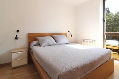 Cama o camas de una habitación en Aparthotel Nou Vielha
