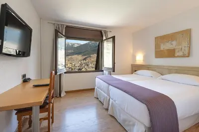 Una televisión o centro de entretenimiento en Hotel Blu Aran