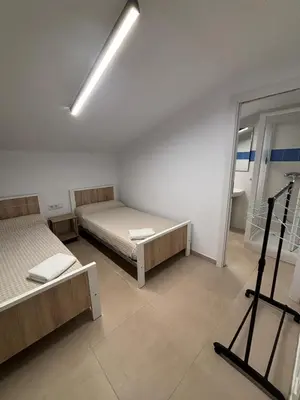 Cama o camas de una habitación en Albergue El Muro