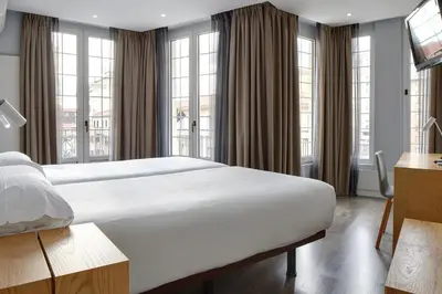 Cama o camas de una habitación en Hotel Avenida
