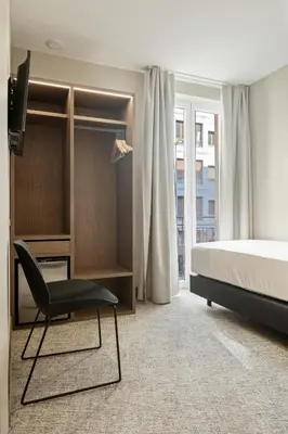 Cama o camas de una habitación en Hotel Avenida