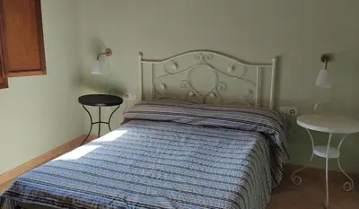 Cama o camas de una habitación en CA L'AIDA RURAL