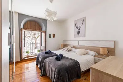 Cama o camas de una habitación en Espectacular apartamento reformado en edificio histórico, con WIFI