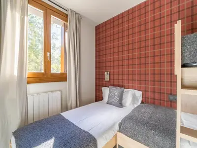 Cama o camas de una habitación en NATUSliving Benasque E