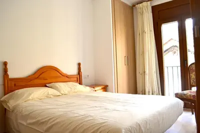 Cama o camas de una habitación en Apartament familiar amb vistes i cèntric by RURAL D'ÀNEU