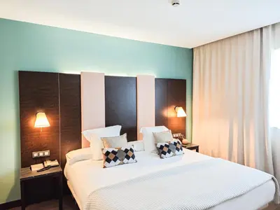 Cama o camas de una habitación en AZZ Pamplona Norte Hotel