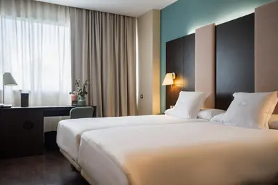 Cama o camas de una habitación en AZZ Pamplona Norte Hotel