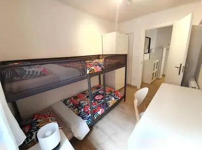 Cama o camas de una habitación en Acogedor piso en el centro de Sabiñanigo
