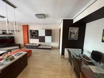 Una televisión o centro de entretenimiento en MuroHouse - Apartamento con piscina