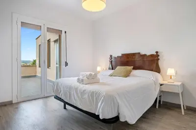Cama o camas de una habitación en Hauzify I Vila Ducal
