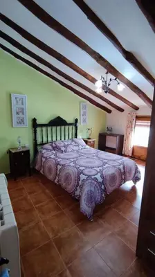 Cama o camas de una habitación en Casa rural LA CRIVA