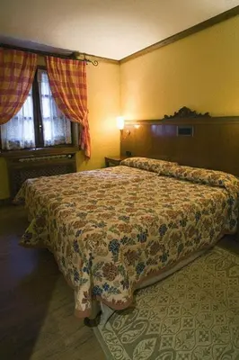 Cama o camas de una habitación en Hotel Hospital de Benasque