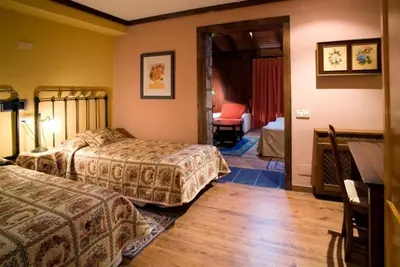 Cama o camas de una habitación en Hotel Hospital de Benasque
