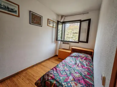 Cama o camas de una habitación en Chimenea, terraza y parking- Tu refugio acogedor - Besiberri 3